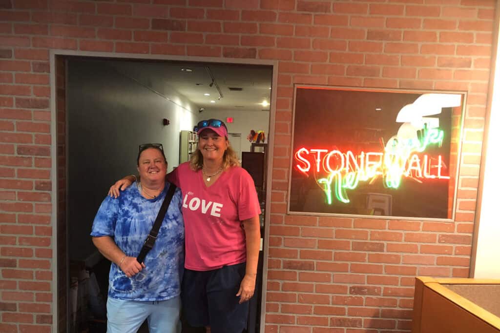 Roxanne and Donna standing in the doorway of the Stonewall Inn Museum exhibit