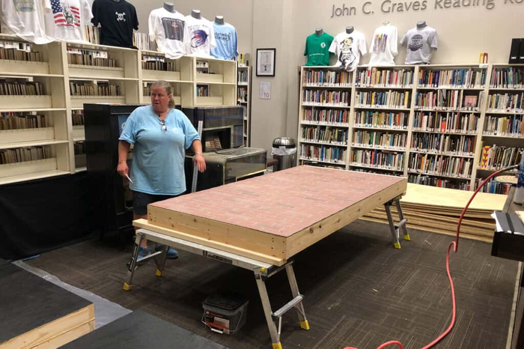 Roxanne working on a portion of the Stonewall Inn exhibit